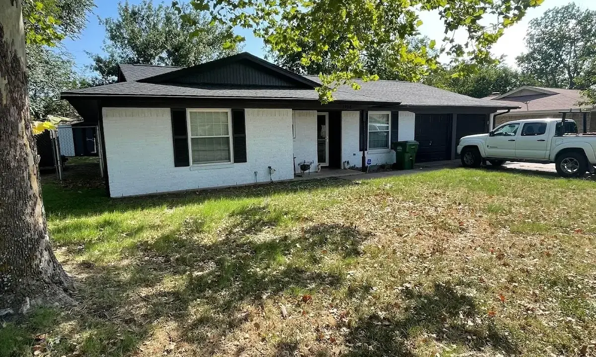 Professional roofing crew working on a residential roof in Rockaway